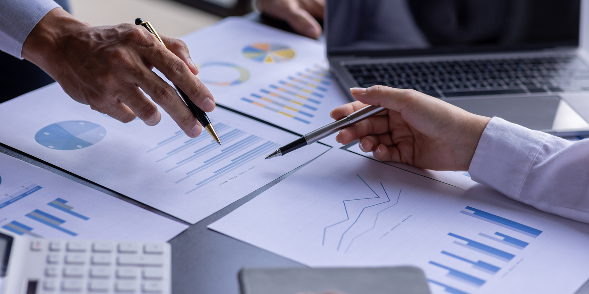 Business meeting with charts and graphs